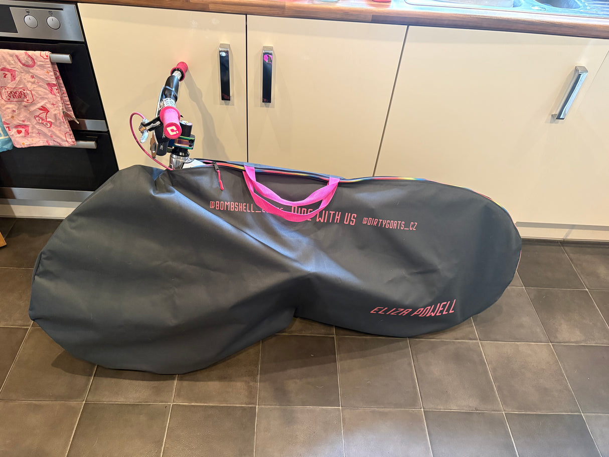 Bombshell Bike Bag, SSS Racing, charcoal gray with neon pink handles, zipper pulls, durable water-resistant fabric, logo.