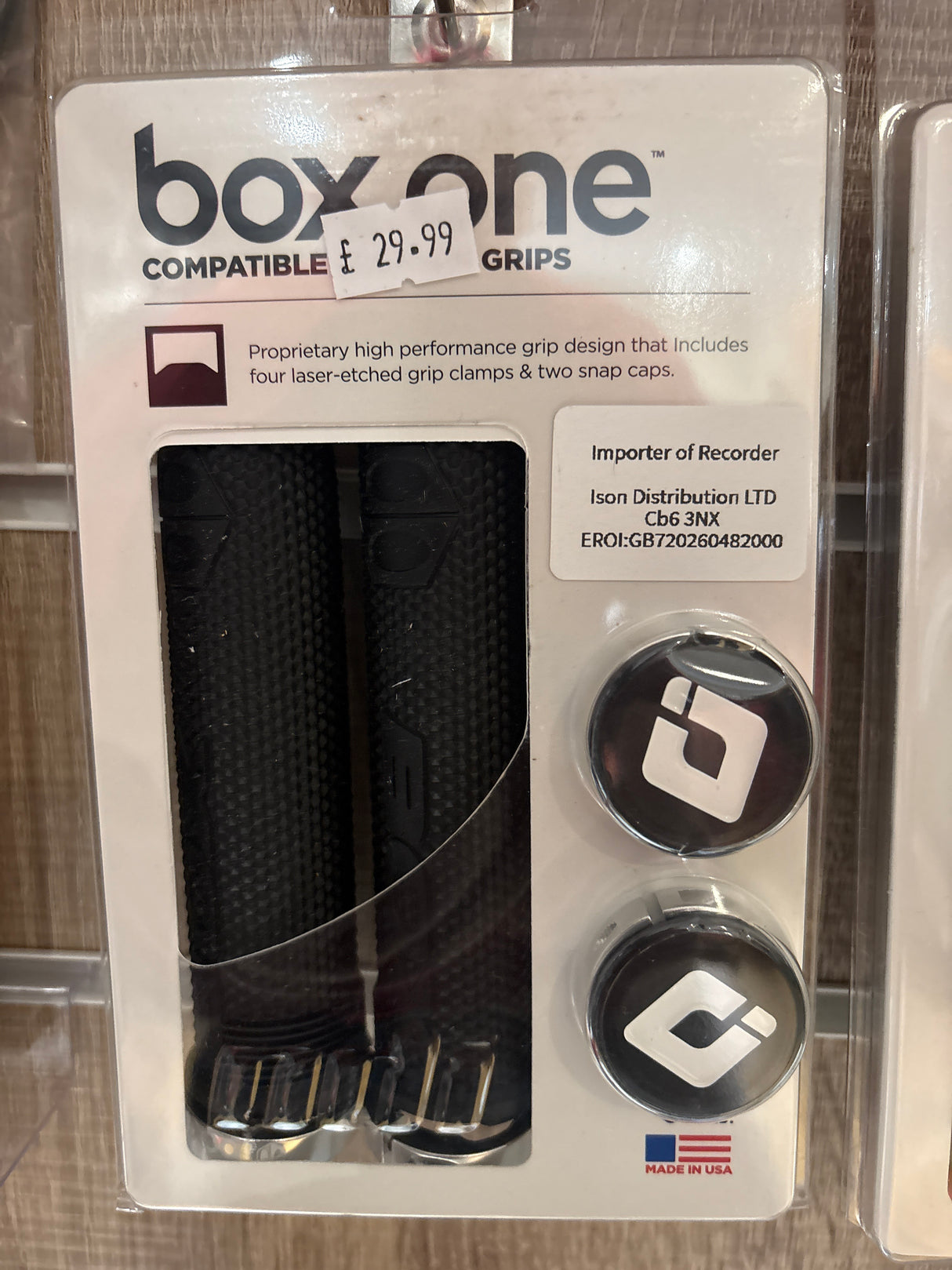 Box One Lock On Grips by SSS Racing with black textured rubber grip, silver aluminum clamps, chrome caps, bold logo, USA-made
