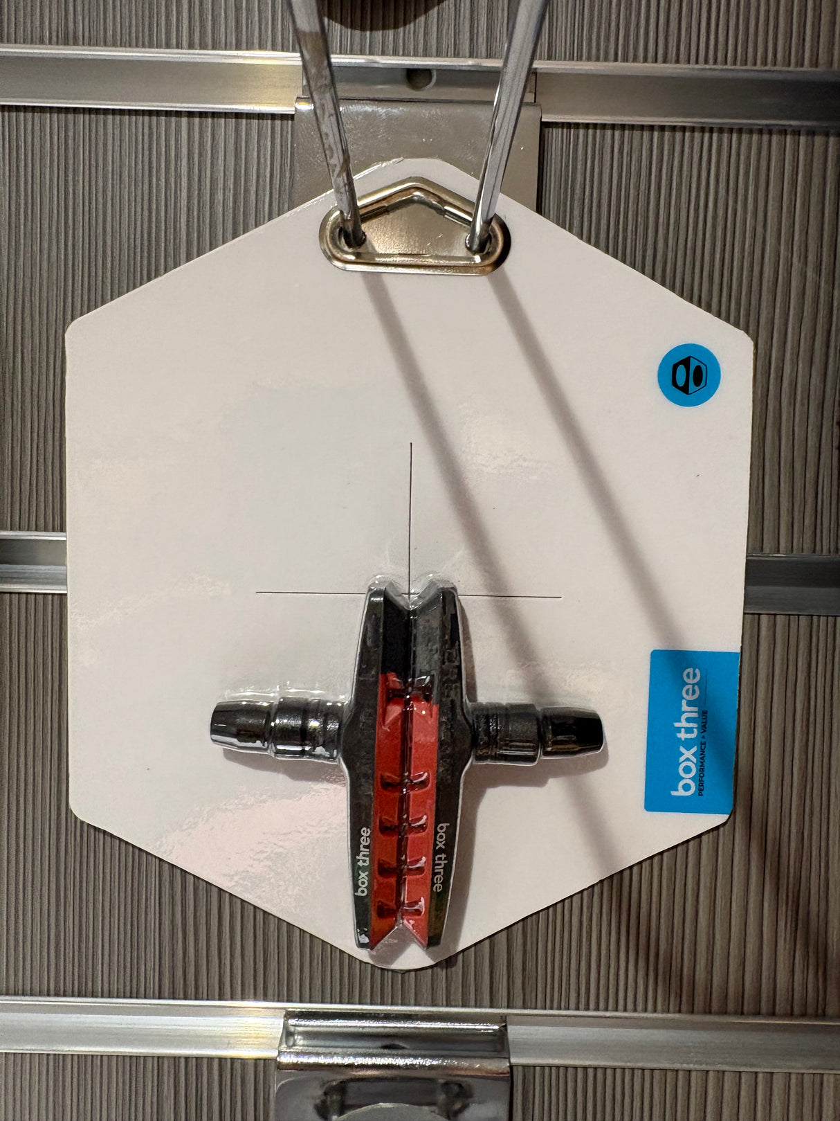 Box Three 70mm Brake Shoes by SSS Racing: red ceramic pads, black alloy backing, silver axles, mounted on white display tag