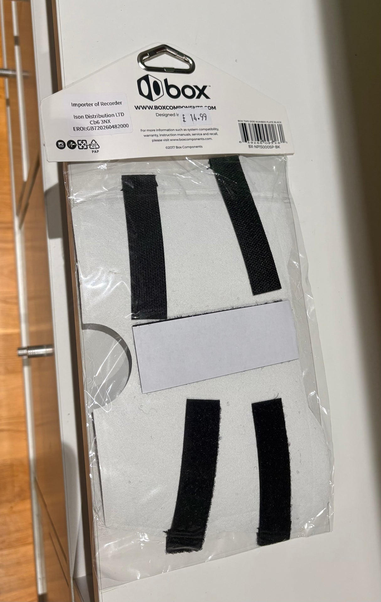 Box Two BMX Side Number Plate by SSS Racing: white panel with black fabric straps, matte finish, mount, durable ABS frame.