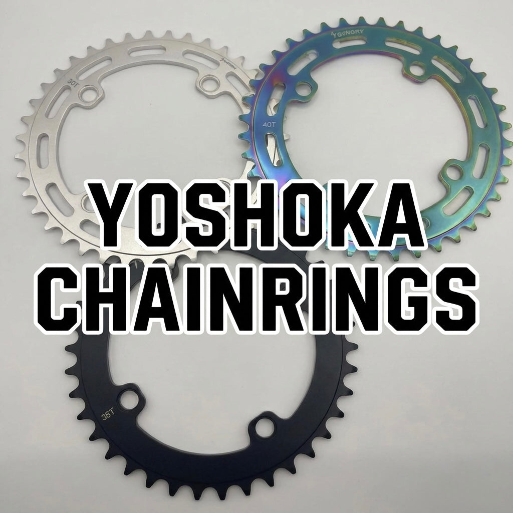 Yoshoka Chainrings Black by SSS Racing: anodized rainbow iridescent blue-green, silver inner ring, CNC aluminum, branding.