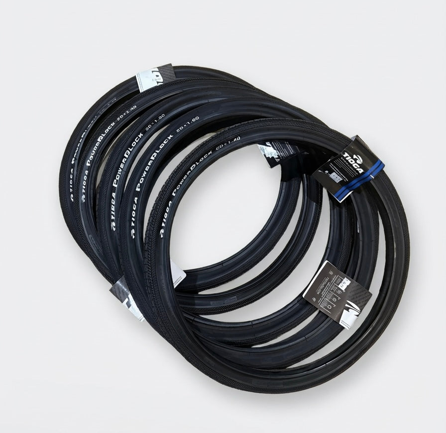 SSS Racing Tioga Powerblock 20” Tyre with dark navy rubber, knurled sidewalls, blue labels, tightly coiled branding tags.
