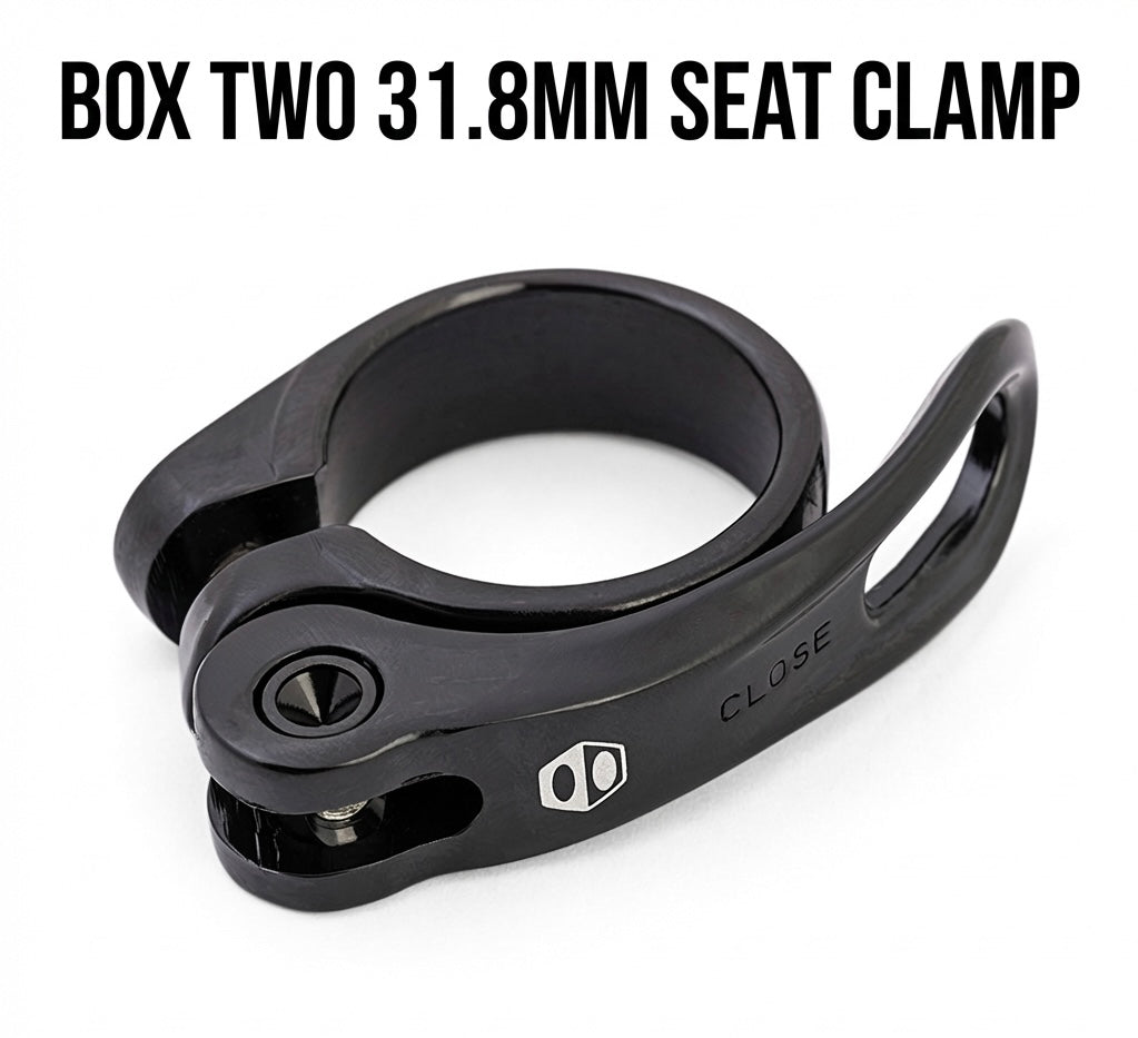 SSS Racing Box Two Quick Release Seat Post Clamp 31.8mm, black aluminum body with silver bolt, compact open clamp, sleek
