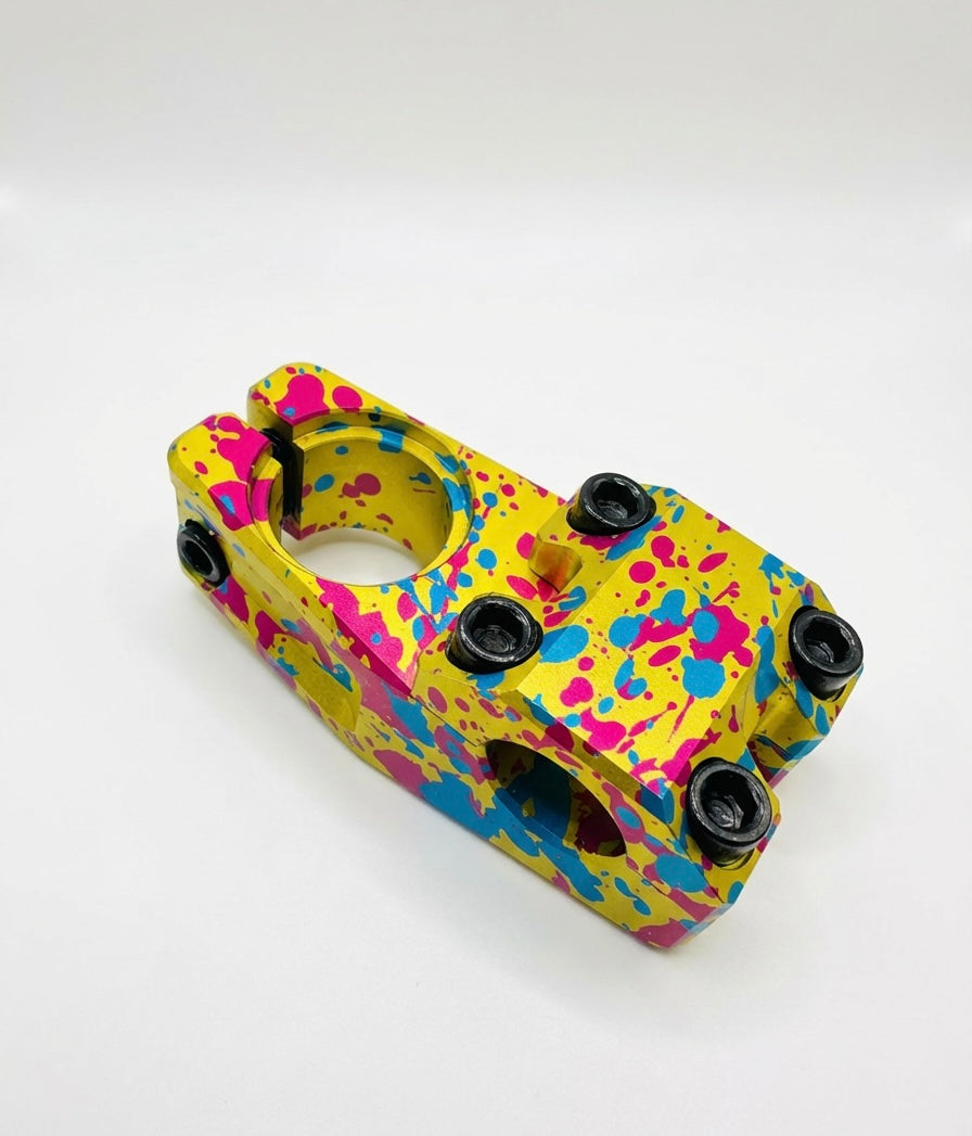 Yoshoka Stem 1-1/8” Steerer 45mmyellow with pink/blue paint splatter, aluminum body, black bolts, SSS Racing finish gloss.