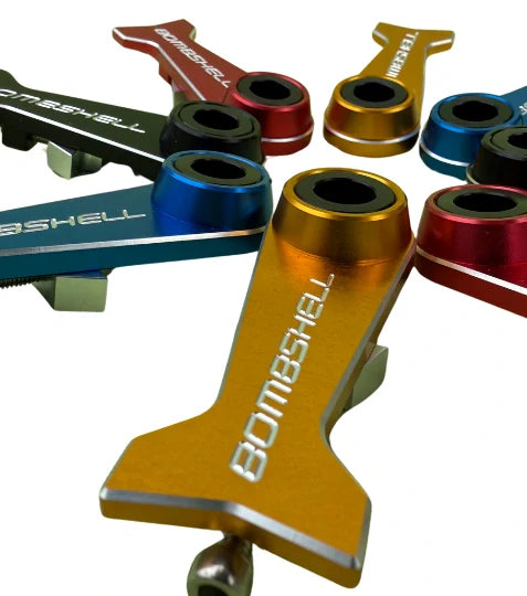 Bombshell Chain Tensioners Pro by SSS Racing, anodized aluminum in yellow, blue, red with black bushings, SSS Racing logo!