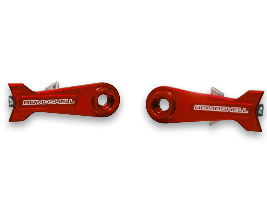 Bombshell Chain Tensioners Pro red anodized aluminum arms by SSS Racing with white BOMBSHELL logo, circular bore, cutouts