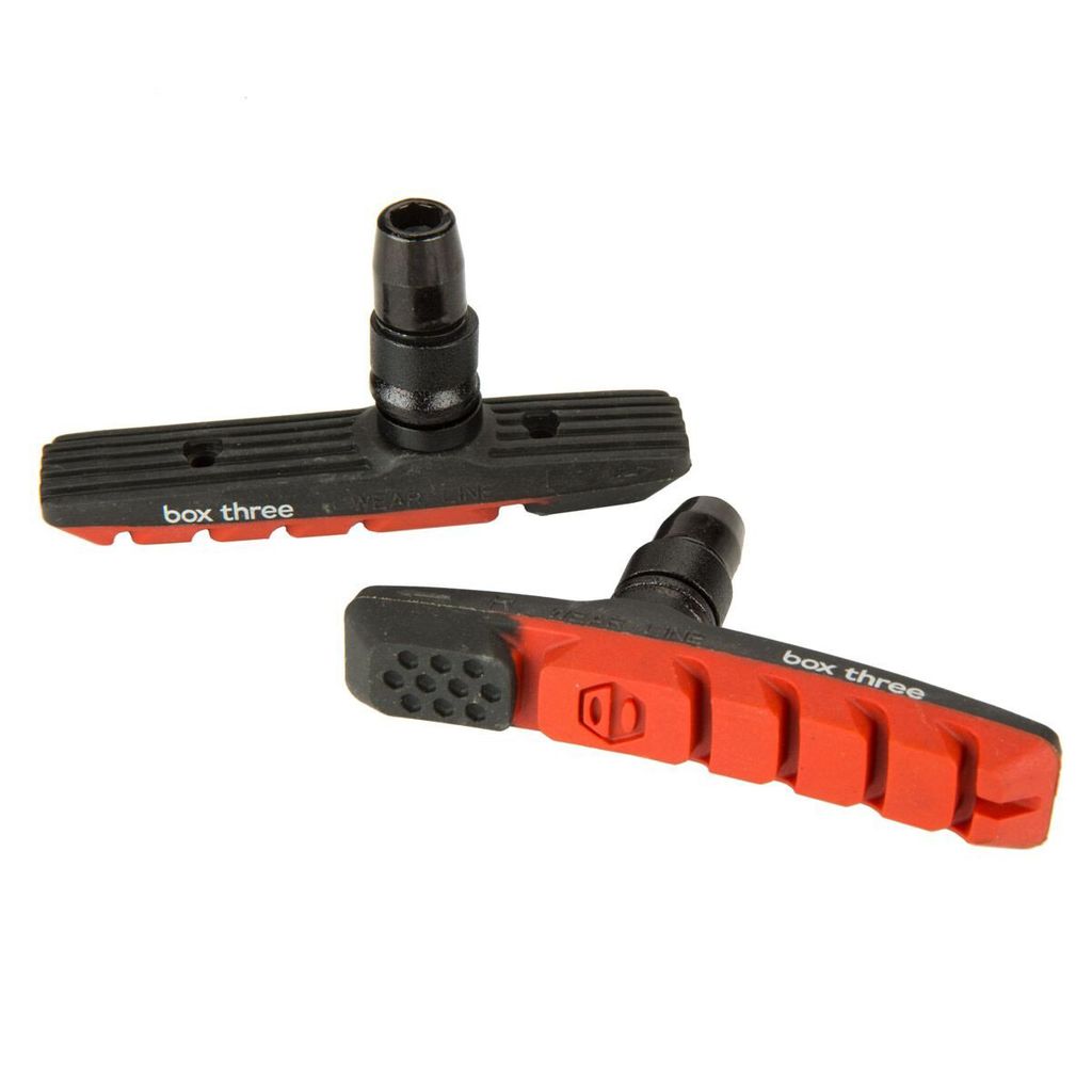SSS Racing Box Three 70mm Brake Shoes in black and red rubber with ribbed bodies, orange bold accents, alloy mounting pins.