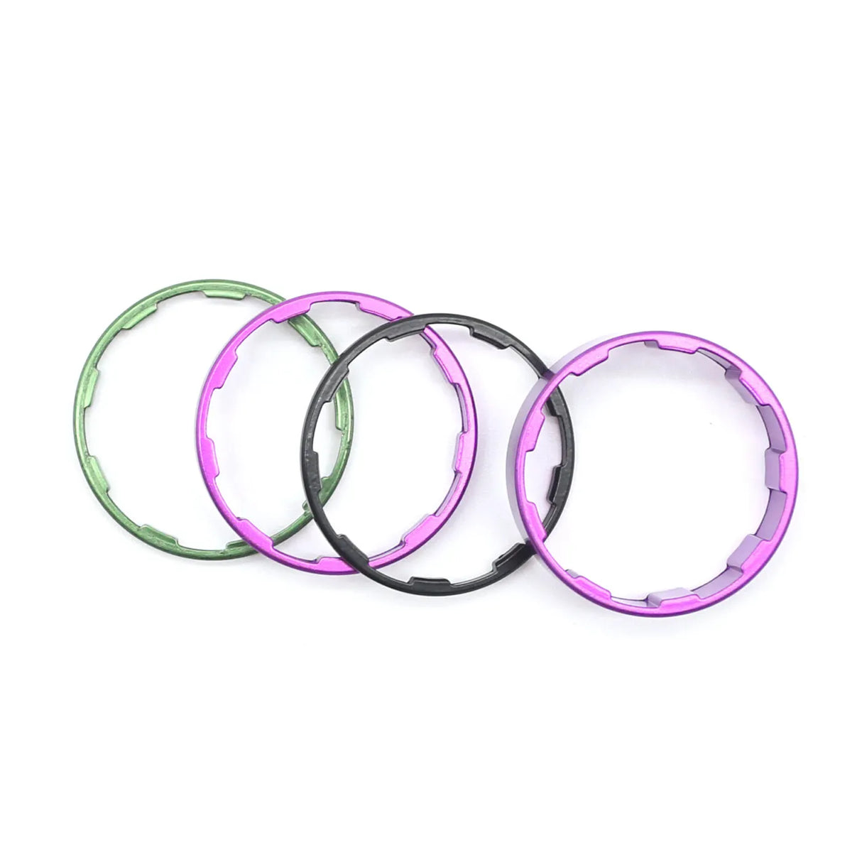 Yoshoka Sprocket Spacers Kit by SSS Racing: anodized aluminum spacers in green, pink, purple, black, with beveled edges.