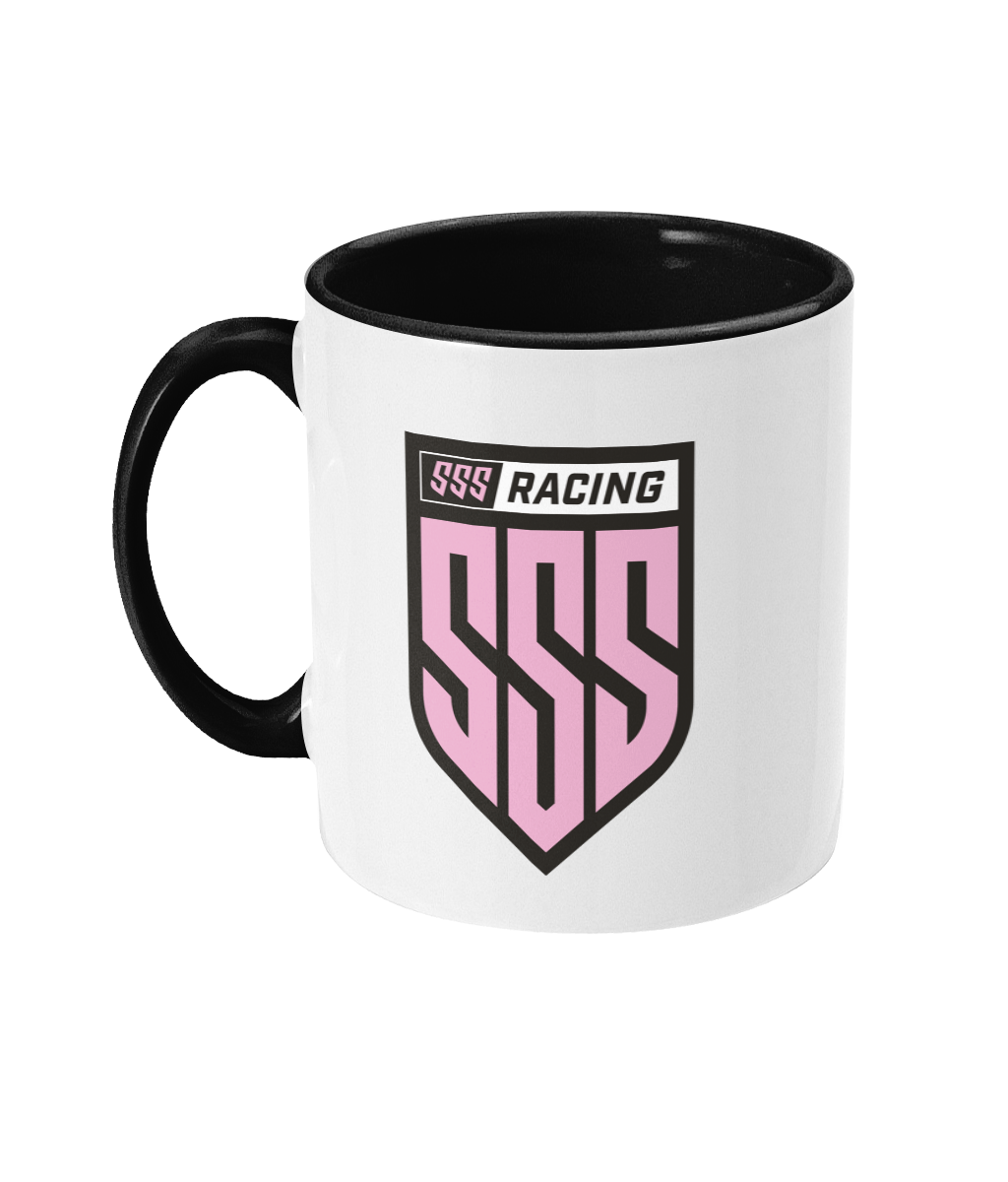 SSS Racing Two Tone Mug features a white ceramic body, black interior and handle, pink shield emblem with bold black outline.
