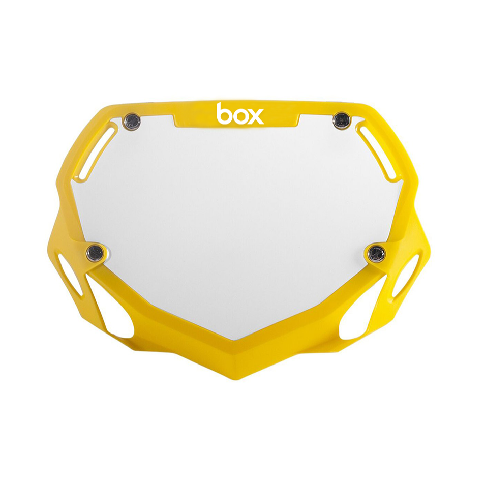 Box Two BMX Number Plates by SSS Racing: yellow aluminum frame, white center panel, black screws, bold logo, glossy finish