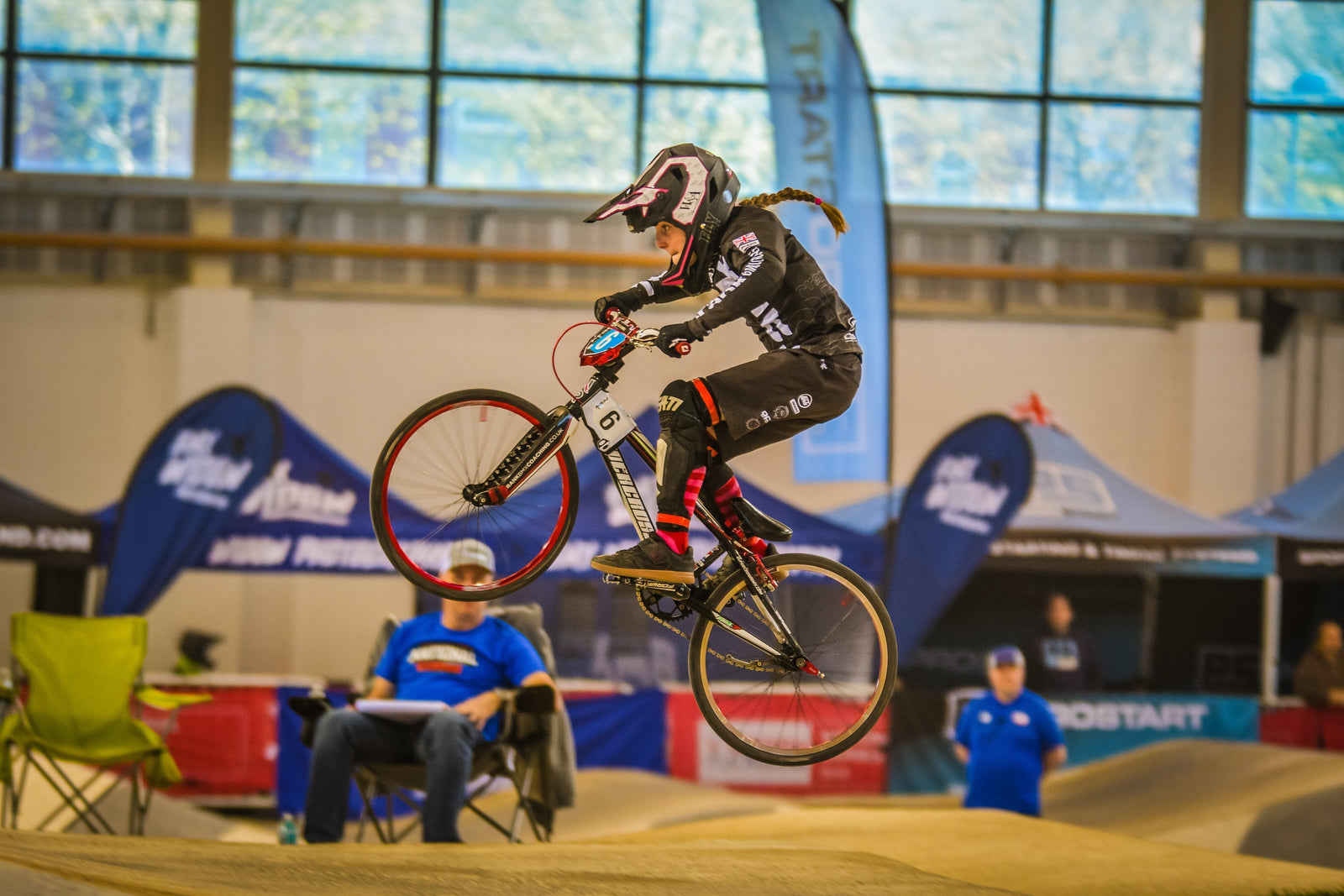 Girl jumping on BMX Race bike 
