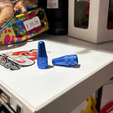 Aluminium Presta Valve Caps in vivid blue with knurled cylindrical shape and hex top, glossy finish and glow with knurling