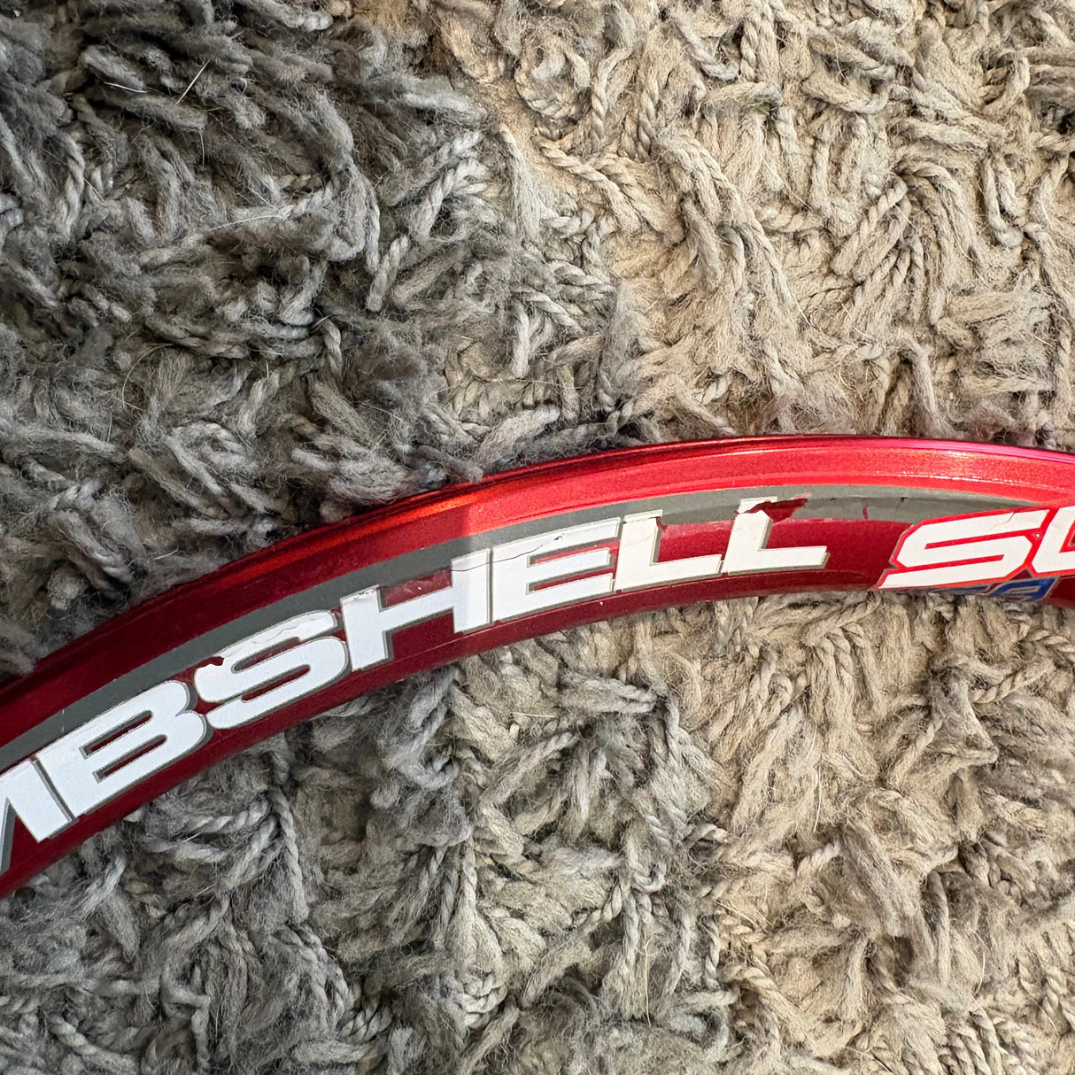 Bombshell Aluminium 28H Expert Wheelset Red by SSS Racing with red alloy rim, bold white graphics, glossy anodized finish.