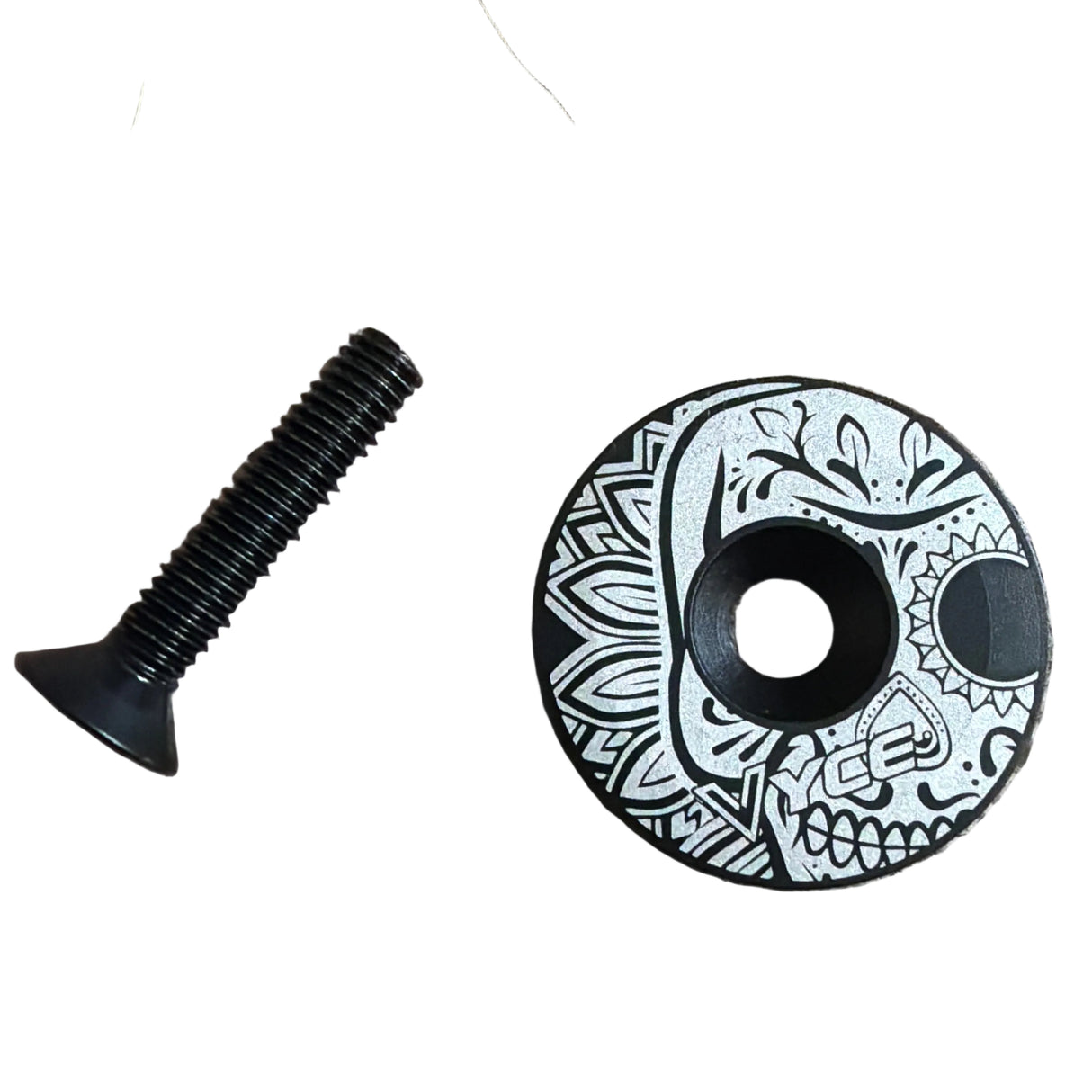Stem Headset Top Cap in black and teal, circular decorative cap with geometric teal pattern and visible bolt threads bolts