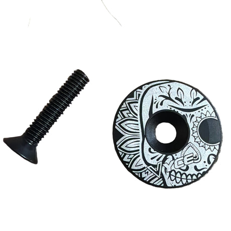 Stem Headset Top Cap in black and teal, circular decorative cap with geometric teal pattern and visible bolt threads bolts