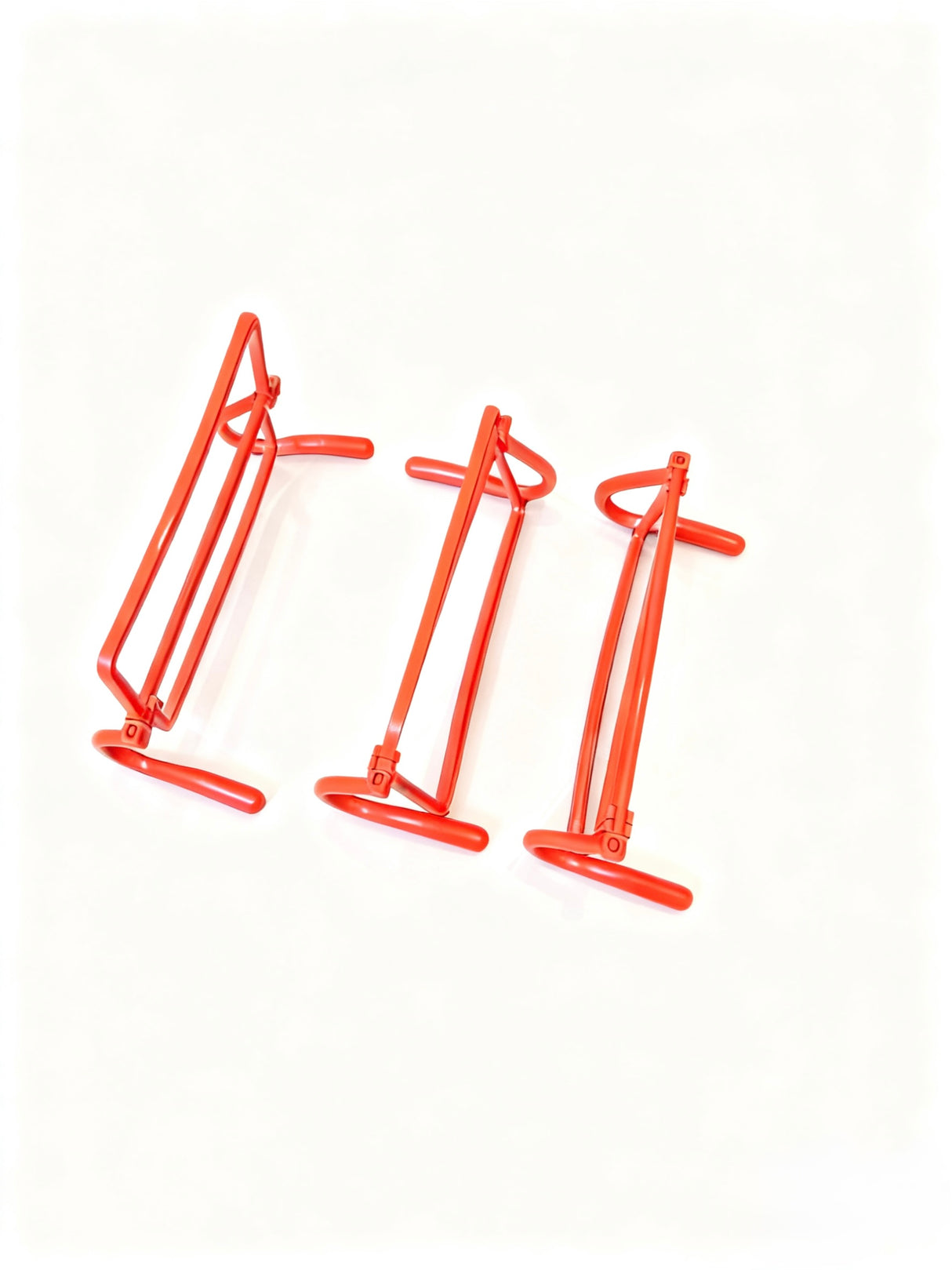BMX Training Hurdles SSS Racing bright red-orange steel frames with curved supports, glossy powder coat on adjustable bases
