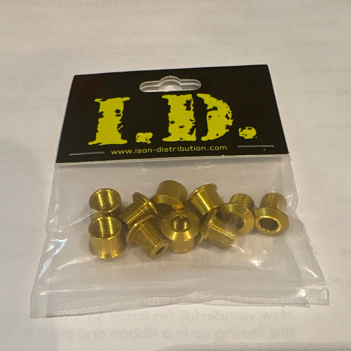 ID Alloy Chainring Bolts by SSS Racing, gold anodized aluminum, knurled hex heads on yellow-black label with bright finish.