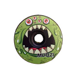 SSS Racing Stem Headset Top Cap in bright green with a multi-eyed cartoon monster, fang teeth, and glossy grip texture.
