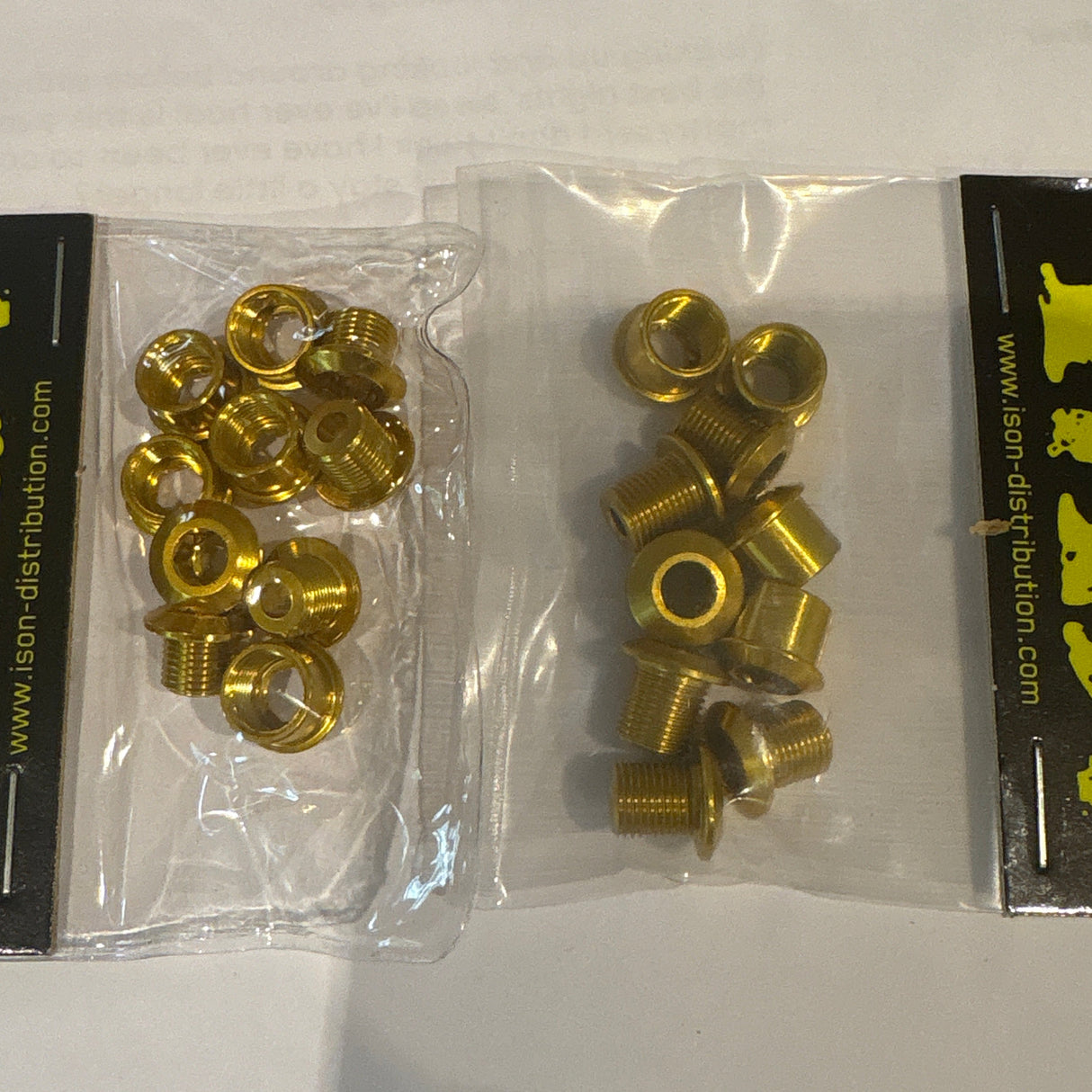 ID Alloy Chainring Bolts by SSS Racing in gold aluminum finish with shiny washers and hex bolts in clear blister pack durable