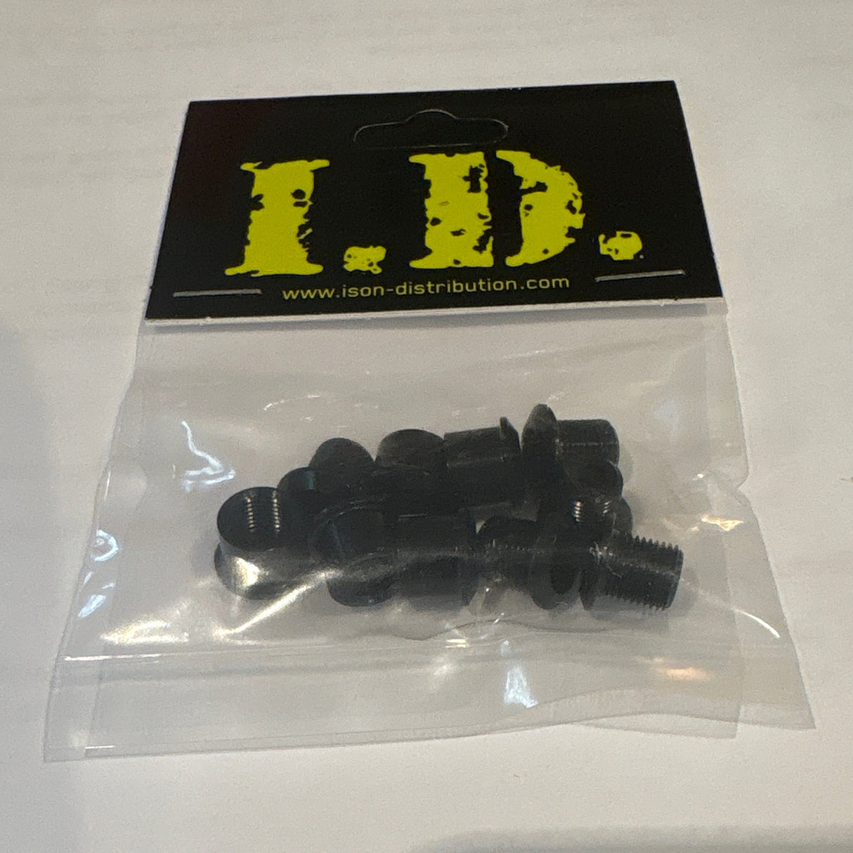 ID Alloy Chainring Bolts by SSS Racing: black anodized aluminum bolts with silver threads, yellow logo, compact precision.