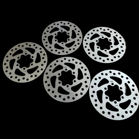 Yoshoka BMX Disc Brake Rotor: silver circular rotor with black inner cutouts and perforated edge holes, high-contrast design.