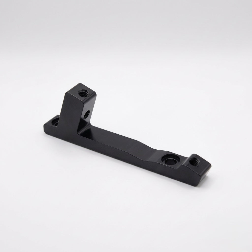 Disc Brake Mount Adapter (Larger Rotor) SSS Racing black anodized aluminum, machined edges, textured finish, dual bolt holes