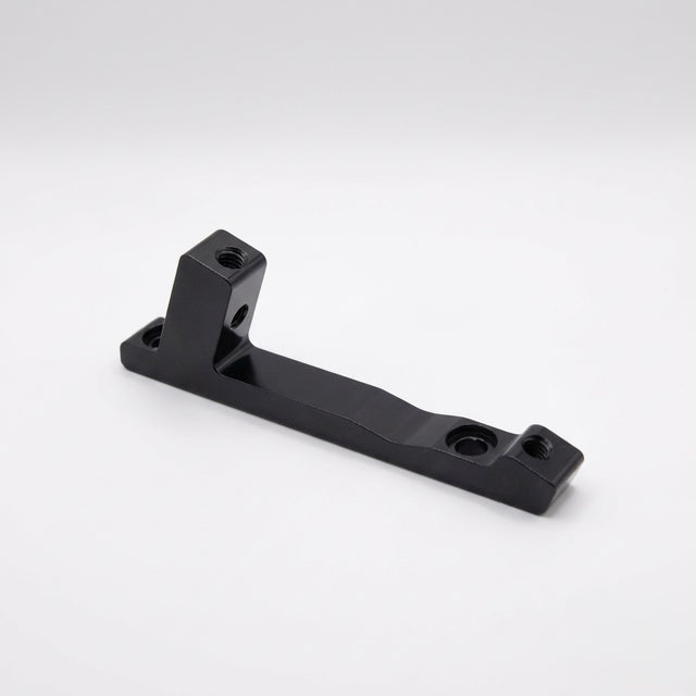 Disc Brake Mount Adapter (Larger Rotor) SSS Racing black anodized aluminum, machined edges, textured finish, dual bolt holes
