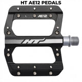 HT AE12 Pedals (Junior) SSS Racing: black aluminum frame, silver spindle, matte finish, L/R markers, rugged CNC build. 