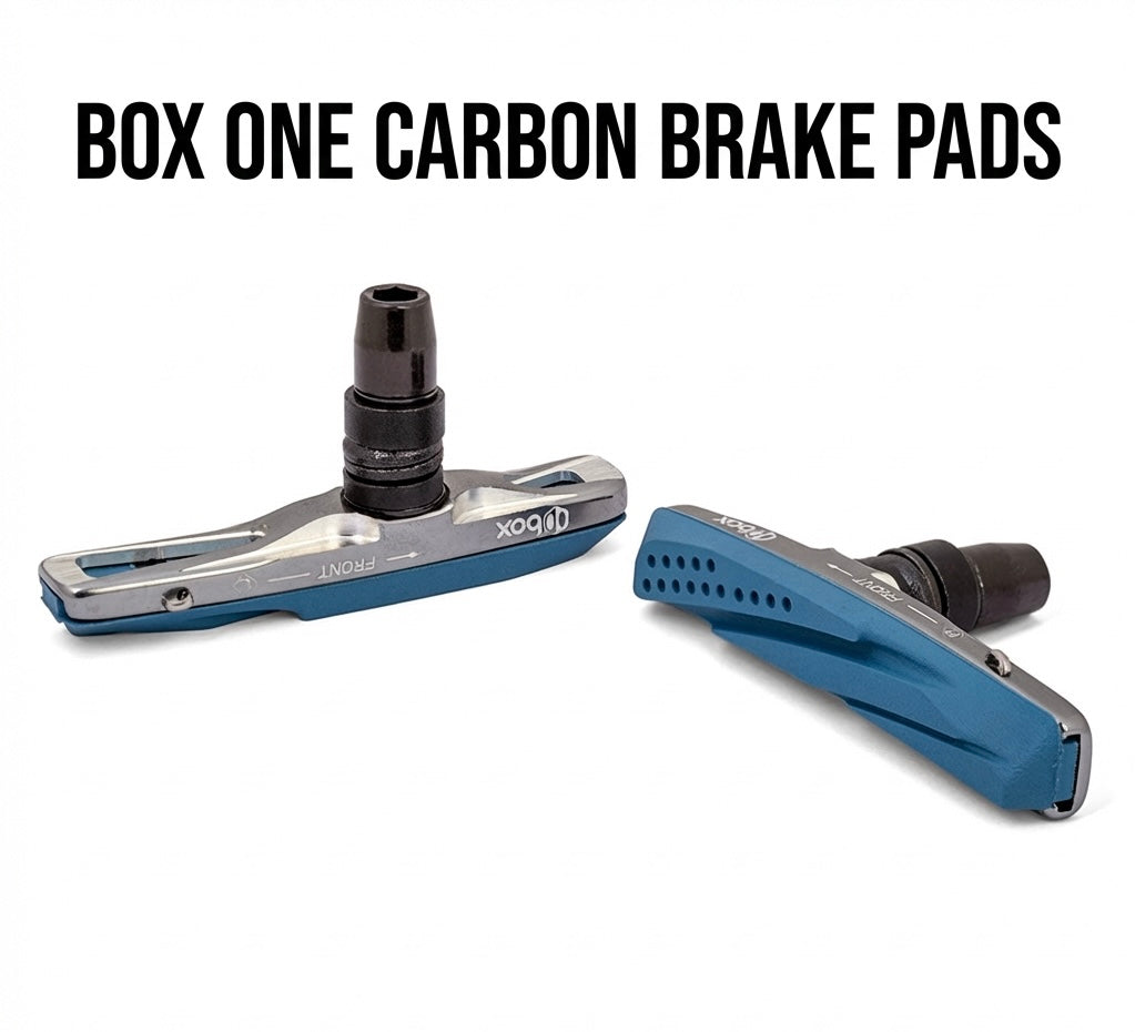SSS Racing Box One Carbon Brake Pads: blue anodized aluminum, silver accents, black mounting stud, high-precision visuals