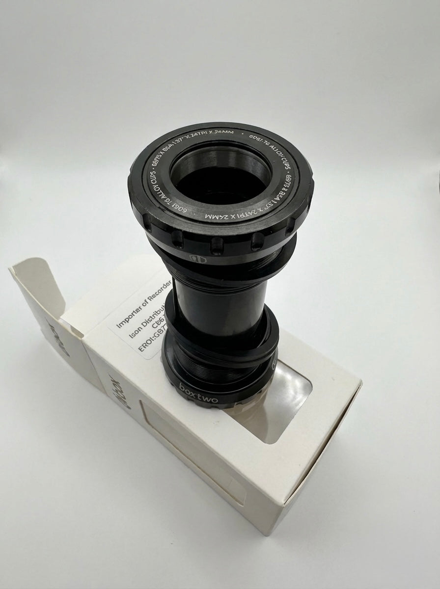 SSS Racing Box Two Bottom Bracket Set 24mm, black anodized aluminum, silver accents, grooved ring, compact cylindrical unit.