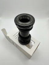 SSS Racing Box Two Bottom Bracket Set 24mm, black anodized aluminum, silver accents, grooved ring, compact cylindrical unit.