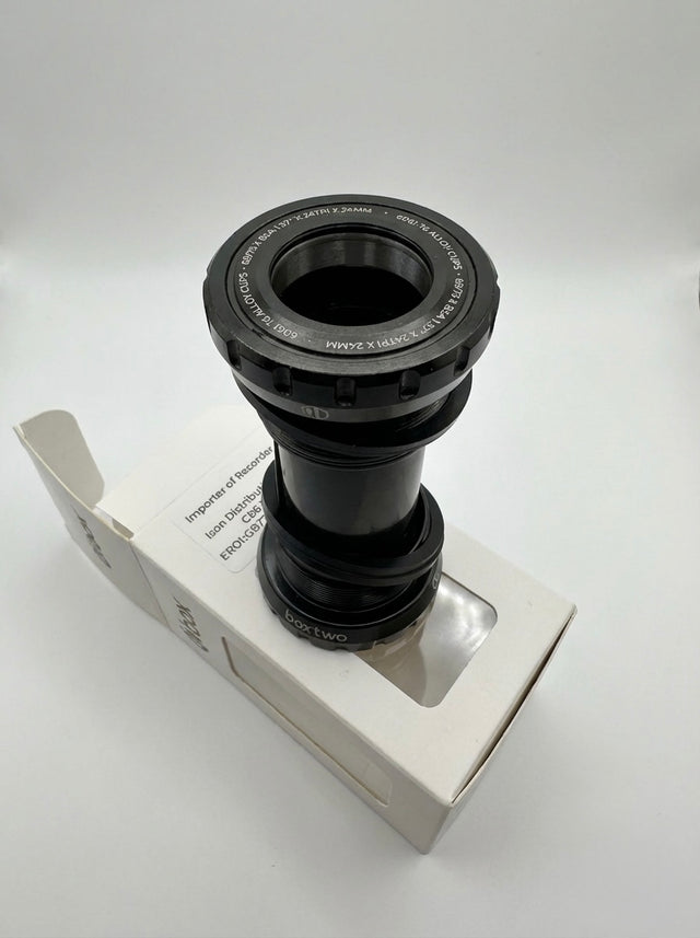 SSS Racing Box Two Bottom Bracket Set 24mm, black anodized aluminum, silver accents, grooved ring, compact cylindrical unit.