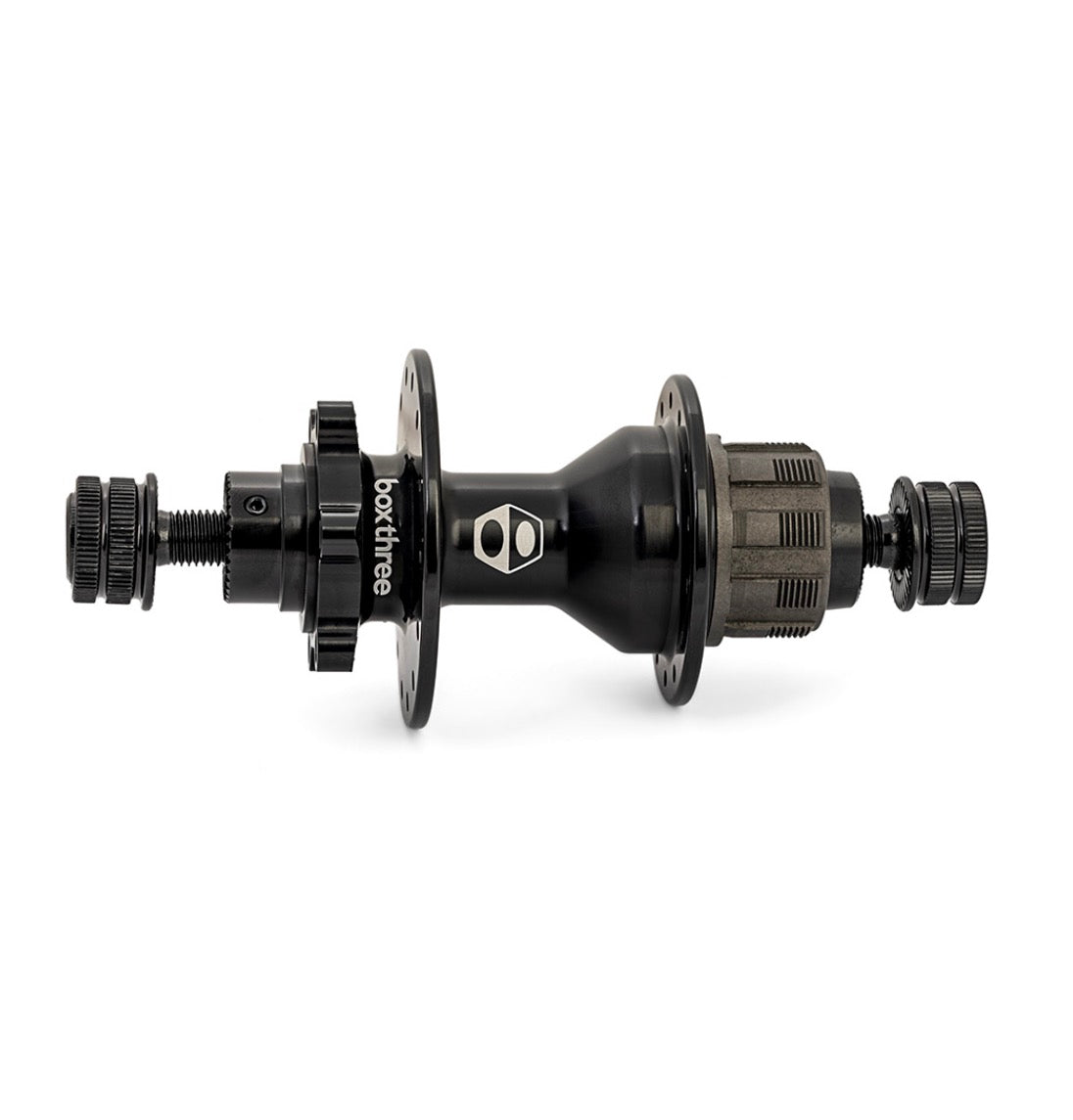 Box Three Stealth Expert Rear Disc Hub: black cylindrical body with silver logo, flanged ends, spoke holes, and cog assembly