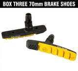 Box Three 70mm Brake Shoes: black and yellow ribbed paddles, rubber contact surfaces, sturdy alloy stems by SSS Racing AI.