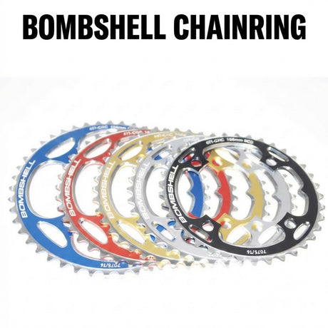 Bombshell Chainring by SSS Racing in assorted anodized aluminum colors (blue, red, gold, silver, black) with sharp teeth.