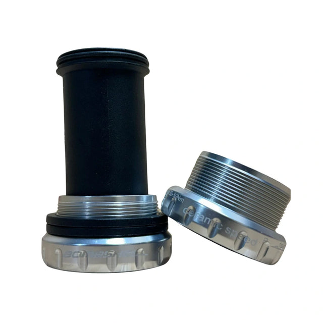 Bombshell Euro Bottom Bracket from SSS Racing in silver aluminum, black inner sleeve, knurled silver cups. BMX racing. 
