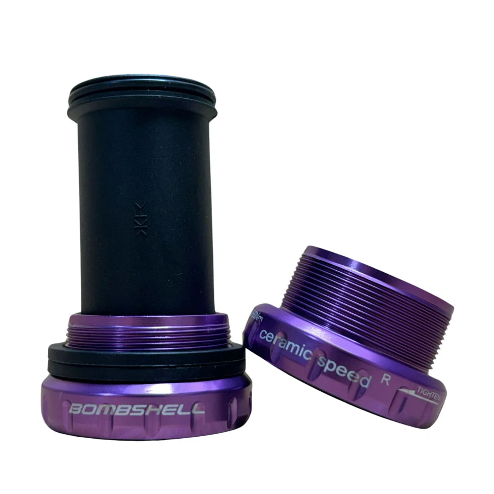 Bombshell Euro Bottom Bracket by SSS Racing purple anodized aluminum, ceramic speed ring, black inner sleeve, glossy finish.