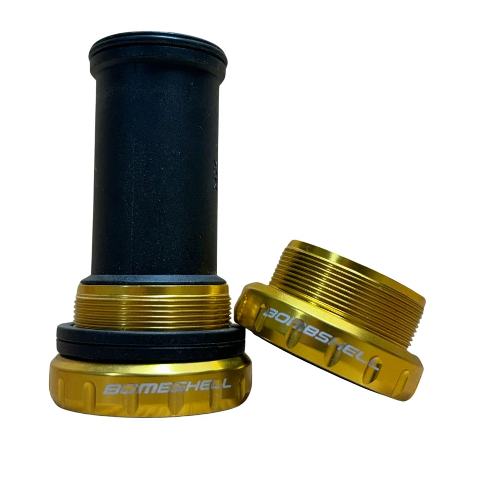 Bombshell Euro Bottom Bracket by SSS Racing: gold anodized aluminium cups, black shaft, bronze threaded rings. BMX racing. 