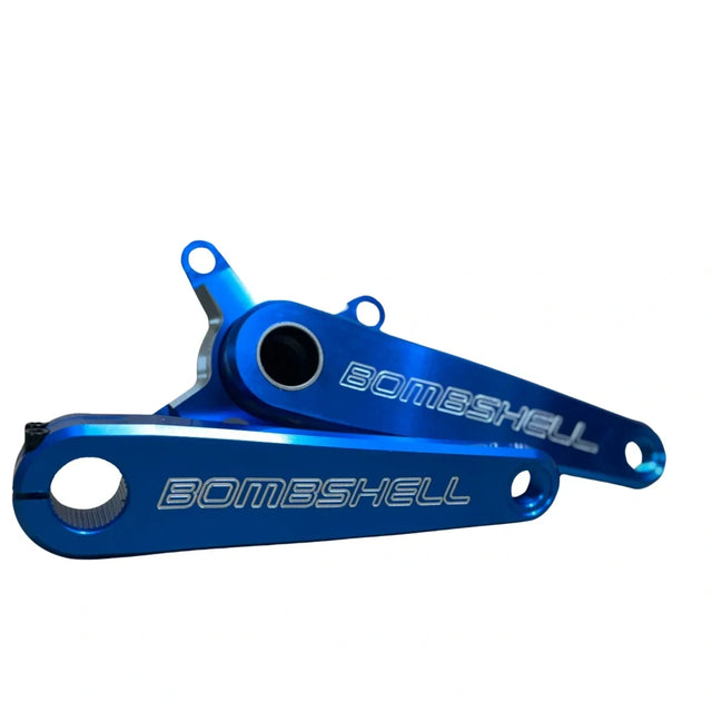 Bombshell 2-Piece Cranks by SSS Racing in blue anodized aluminum, CNC-machined hollow arms with embossed BOMBSHELL logo.
