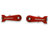 Bombshell Chain Tensioners Pro red anodized aluminum arms by SSS Racing with white BOMBSHELL logo, circular bore, cutouts