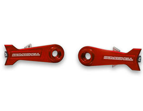 Bombshell Chain Tensioners Pro red anodized aluminum arms by SSS Racing with white BOMBSHELL logo, circular bore, cutouts