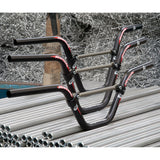 Renthal Moto Bars: black matte aluminum handlebars, red logo accents, sturdy clamps, smooth CNC bends. Ideal for BMX racing. 
