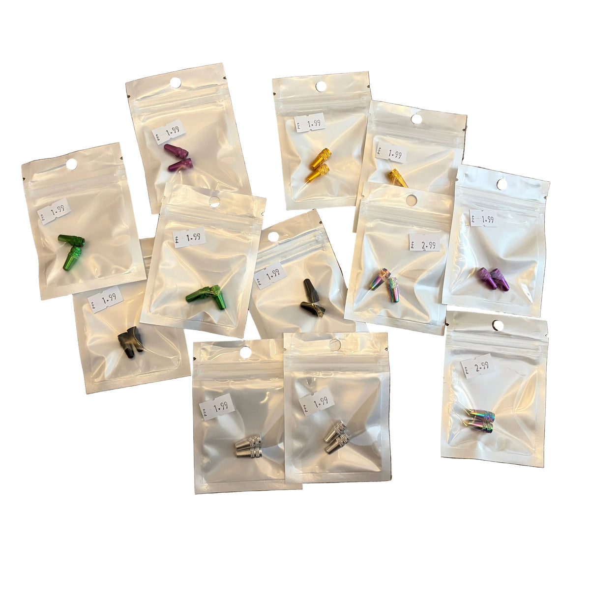 Aluminium Presta Valve Caps in assorted colors (green, purple, gold) with cone shape and ridged grip in clear bag packaging.