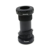 Yoshoka Euro Bottom 24mm SSS Racing black anodized aluminum bottom bracket with knurled collars, matte finish, 24mm spindle
