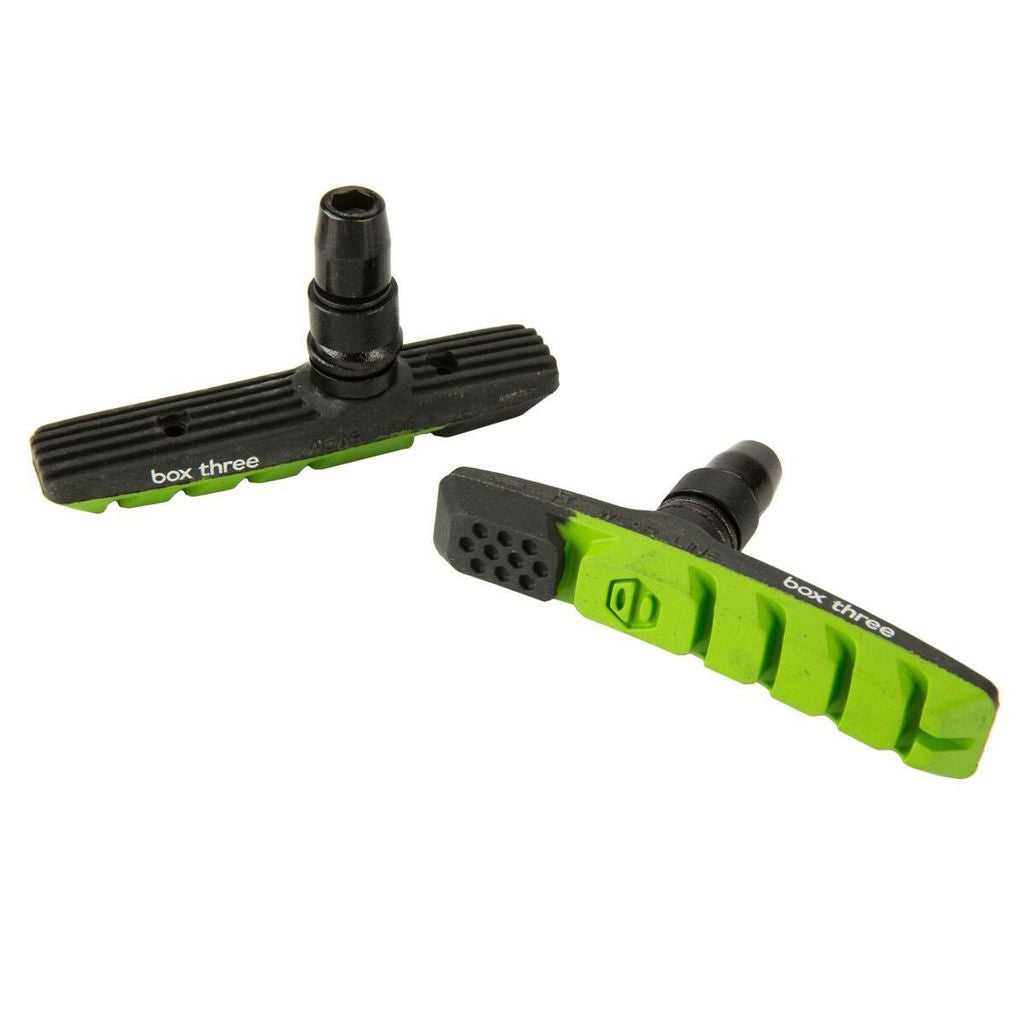 SSS Racing Box Three 70mm Brake Shoes feature black and lime-green pads, ribbed bodies, green inserts, precise moulding.