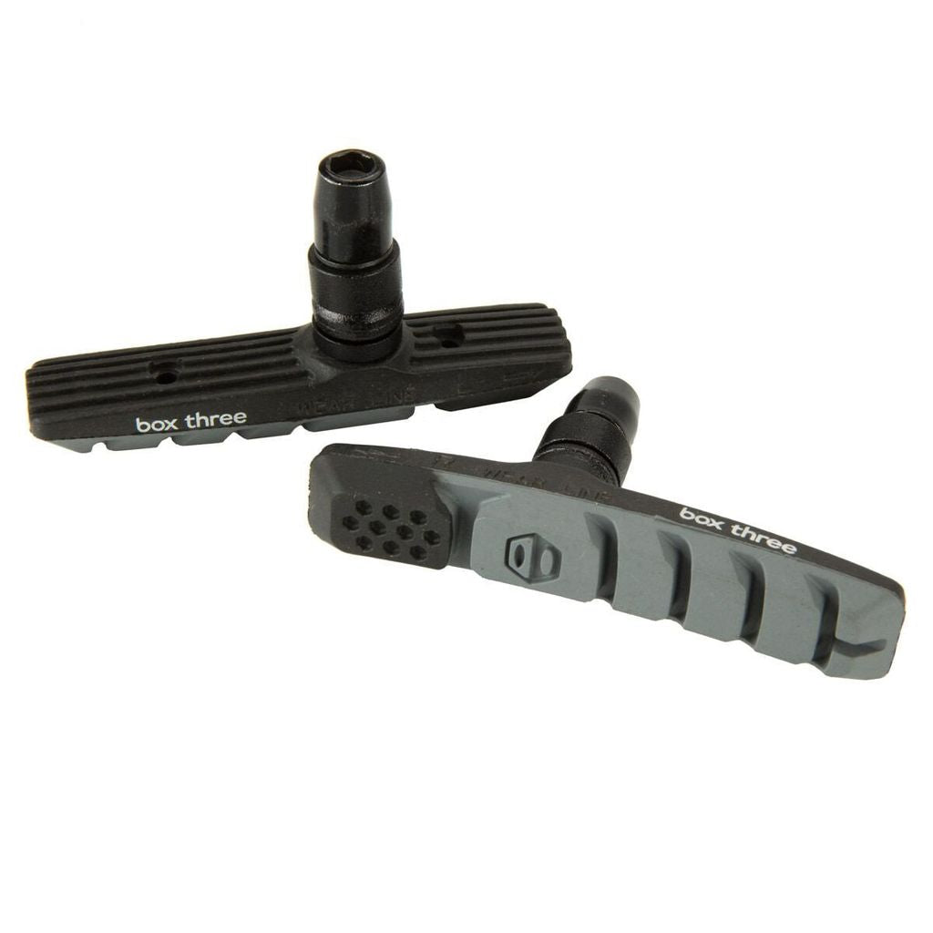 SSS Racing Box Three 70mm Brake Shoes in black and gray, ribbed composite pads with threaded mounting stud and vented slots.