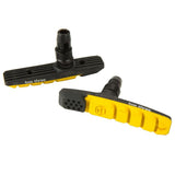 SSS Racing Box Three 70mm Brake Shoes in black and yellow, reinforced polymer body, ribbed texture, dual-housing studs now.