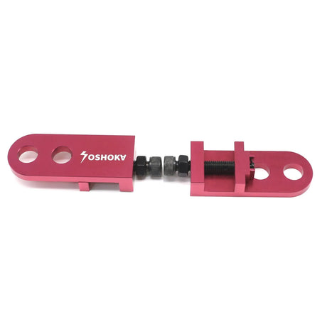 Yoshoka Two-Hole Chain Tensioner by SSS Racing in magenta aluminum with black screws, precise lever, compact construction.