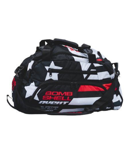 Bombshell Training Kit Bag in black, white, and red with star pattern, compact rounded shape, multiple zip pockets, handles.