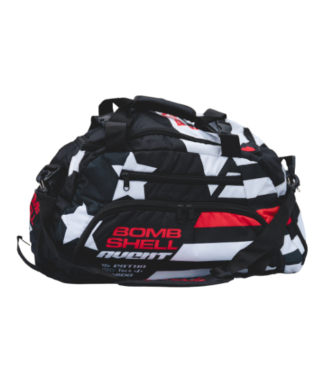 Bombshell Training Kit Bag in black, white, and red with star pattern, compact rounded shape, multiple zip pockets, handles.